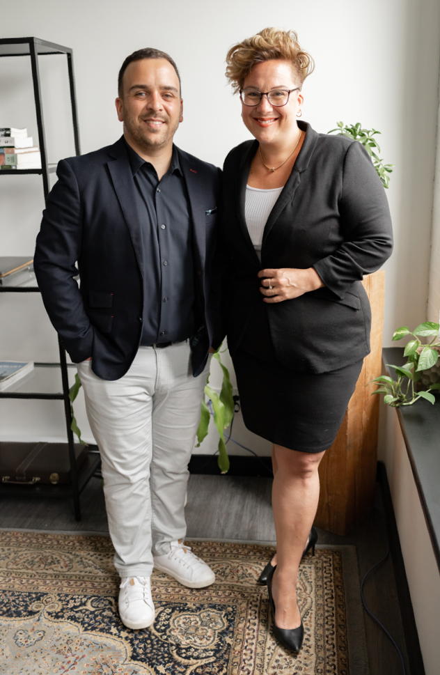 Doiron & Ouellette standing in an office