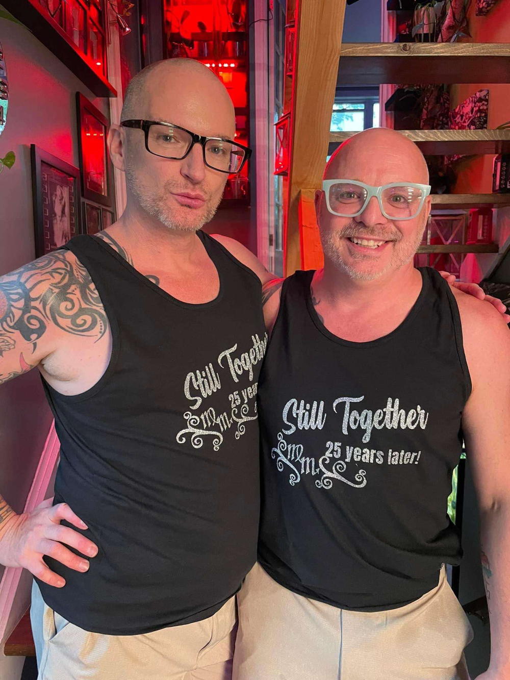 indoors, Jacob & Steve in matching black tank tops