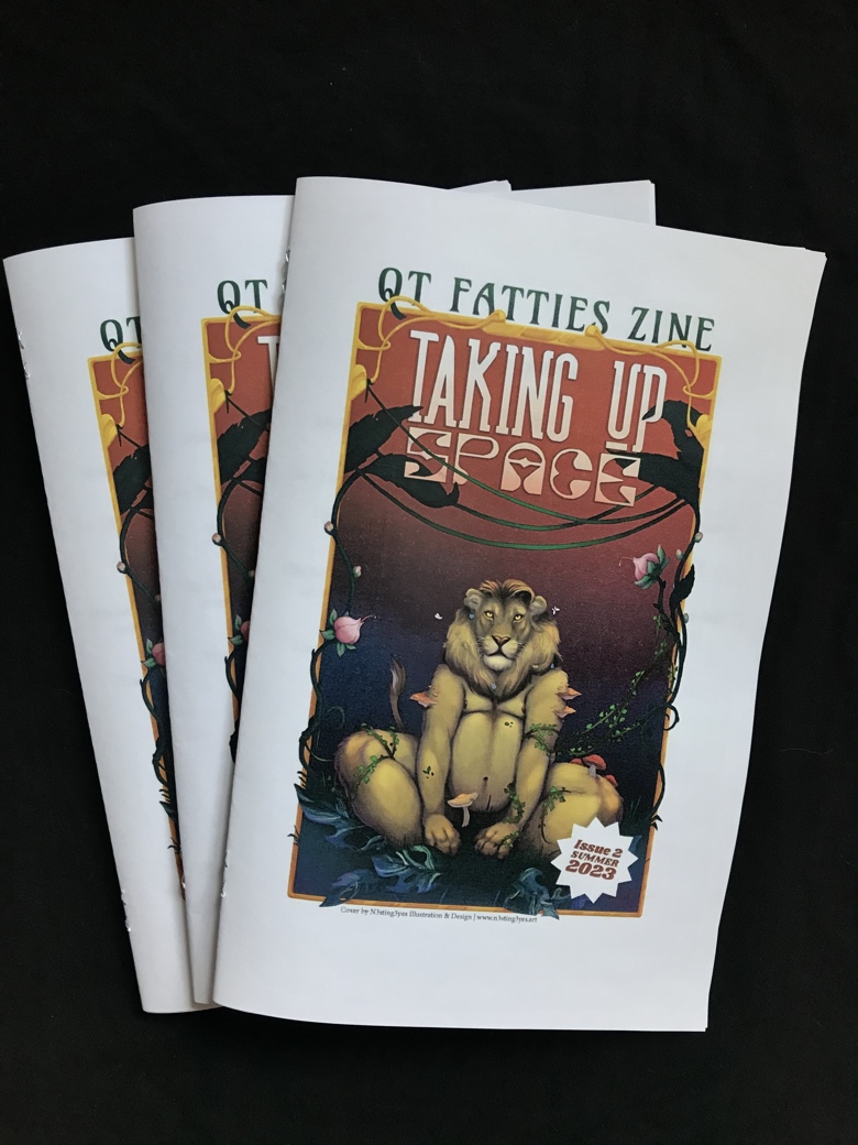 stack of magazines entitled "Taking Up Space" cover shows a seated lion looking at usover shows 