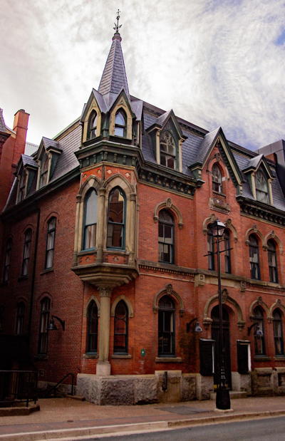 Brick 3-storey building with the turret centered