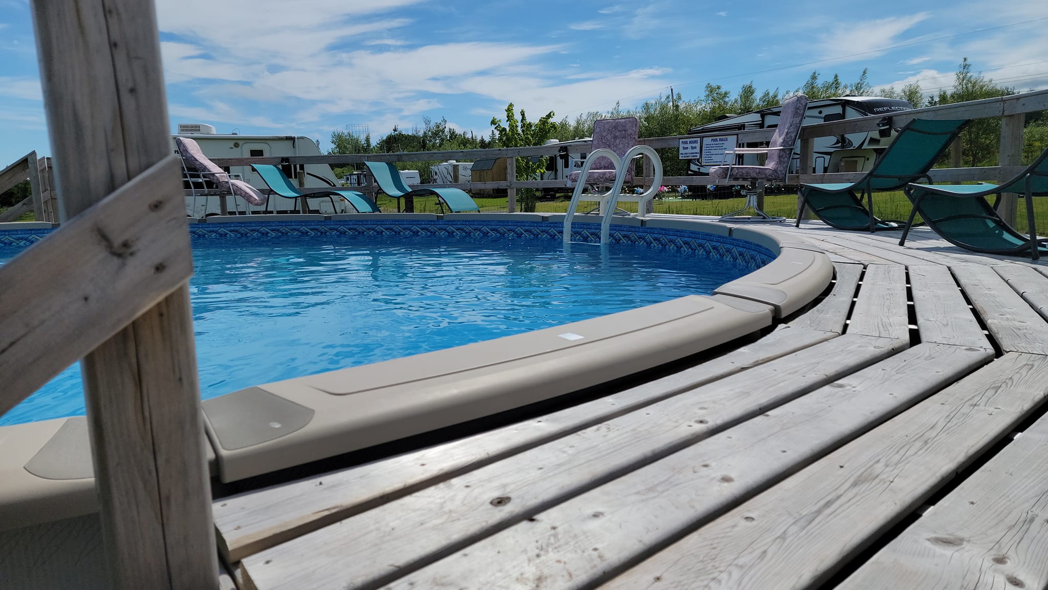 above ground pool with wooden deck 