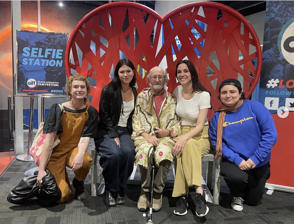 AIFF staff at the Selfie Station with Jim in a gold robe in the centre